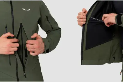 Męska kurtka z materiału softshell w kolorze khaki. Detale: logo, zamki, kaptur, kieszenie. Idealna na wędrówki.