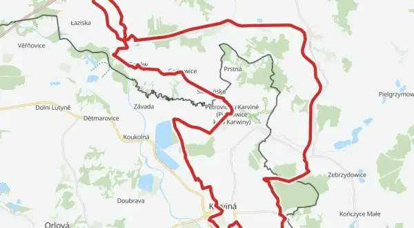 Mapa z zaznaczonym czerwonym szlakiem rowerowym, biegnącym przez tereny przygraniczne Polski i Czech, w okolicach Jastrzębia-Zdroju i Karwiny.