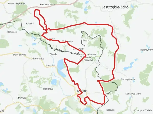 Mapa z zaznaczonym czerwonym szlakiem rowerowym, biegnącym przez tereny przygraniczne Polski i Czech, w okolicach Jastrzębia-Zdroju i Karwiny.